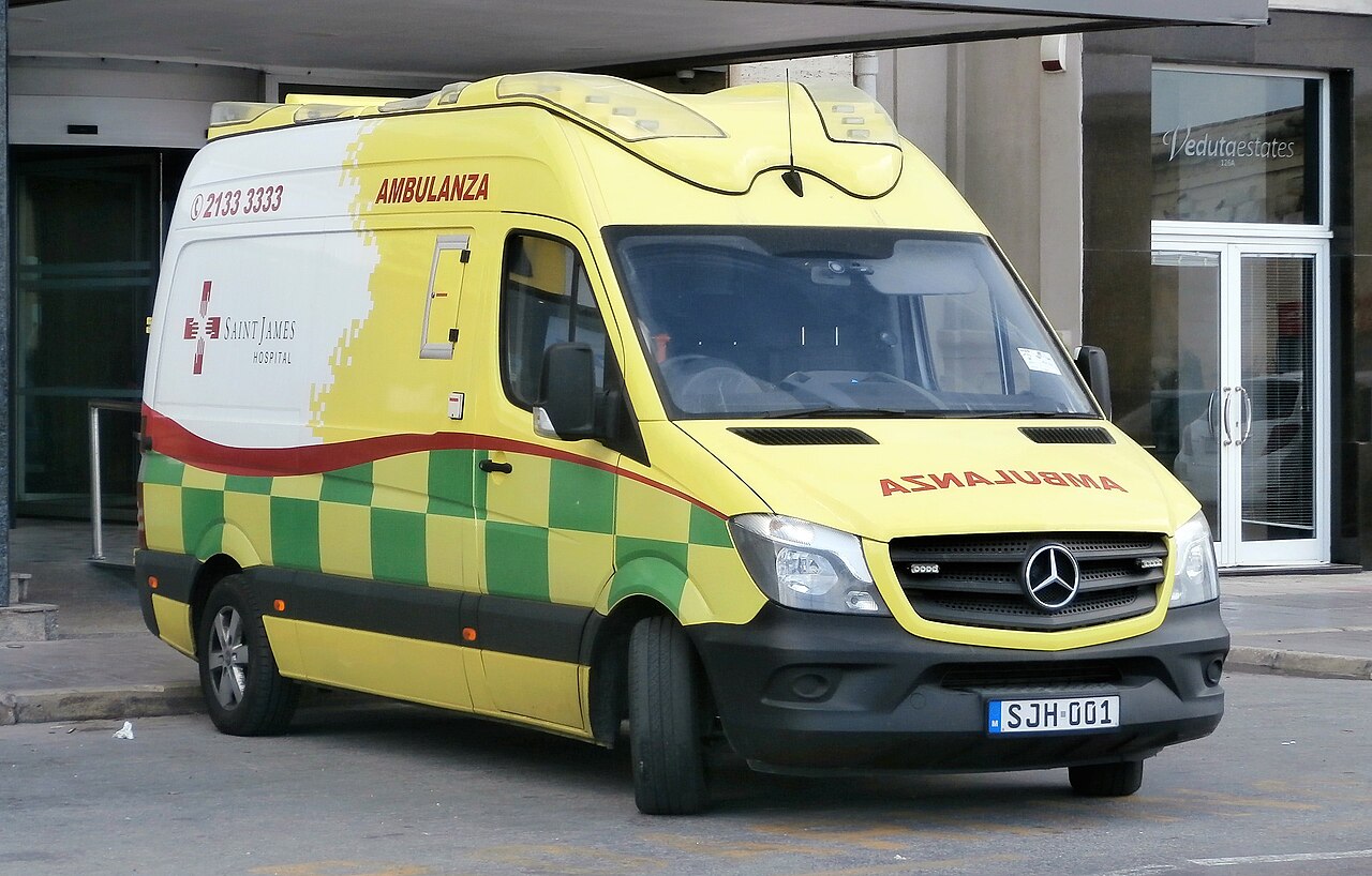 Yellow and green ambulance parked in Malta