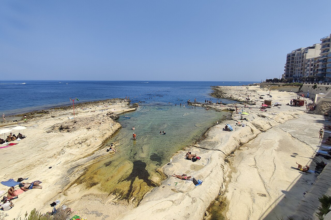 Fond Għadir rocky beach and rock pool below the Sliema promenade