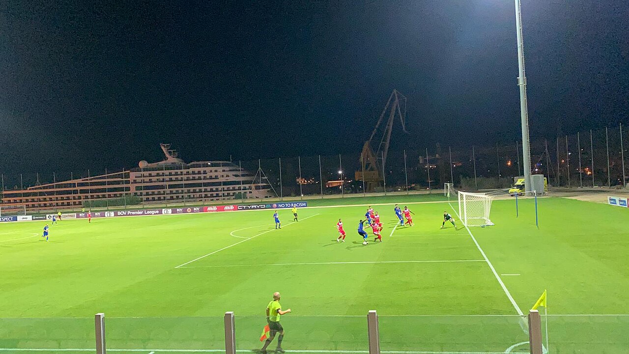 Floodlit football match involving Sliema Wanderers, seen from the stand