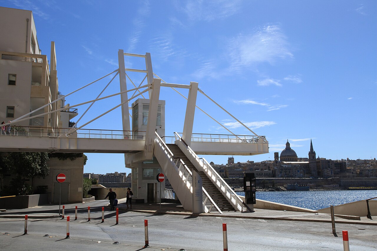 The Tigné pedestrian bridge with its white cable supports, Valletta…