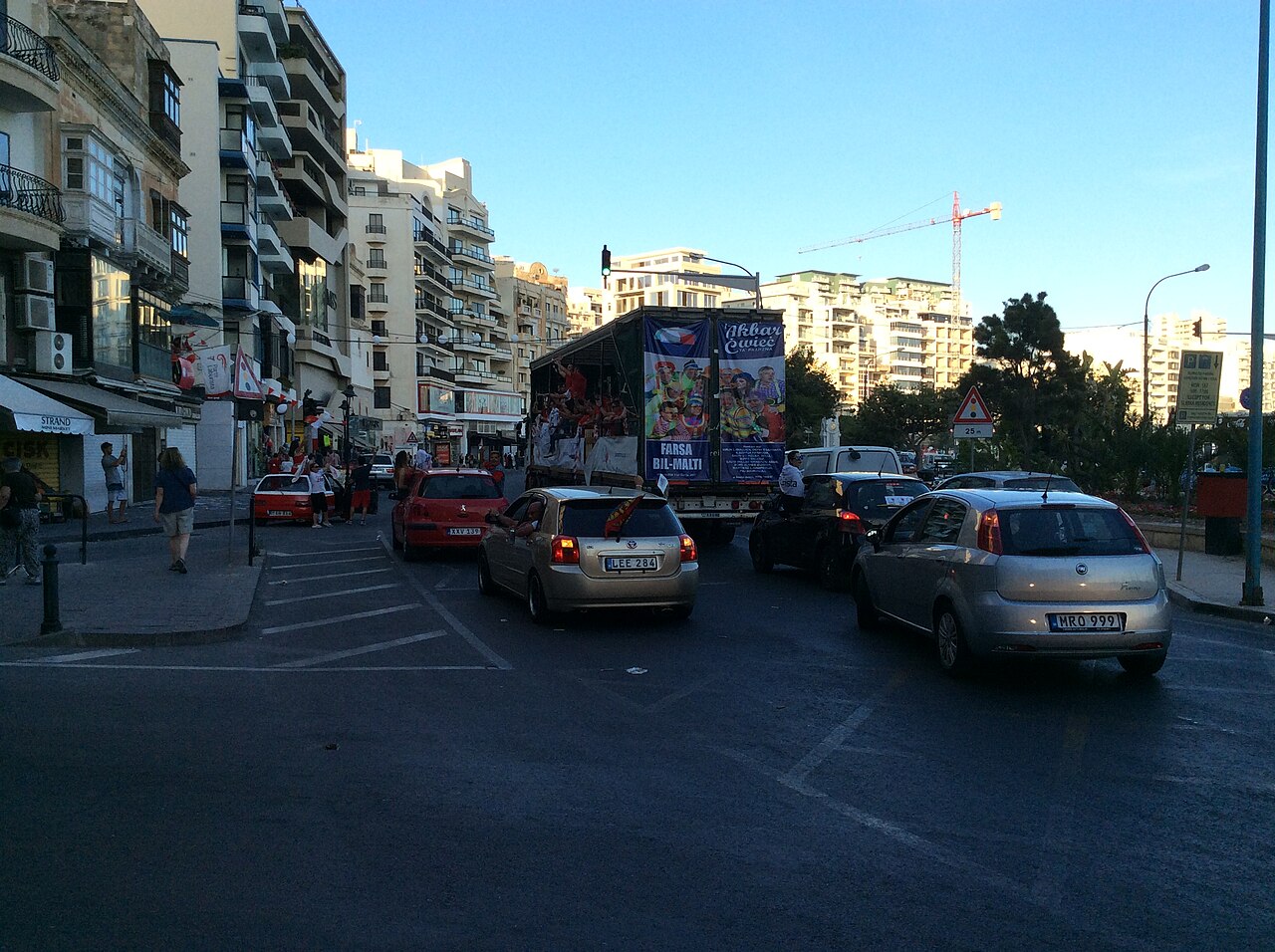 Cars queuing in traffic on a Sliema street in the evening