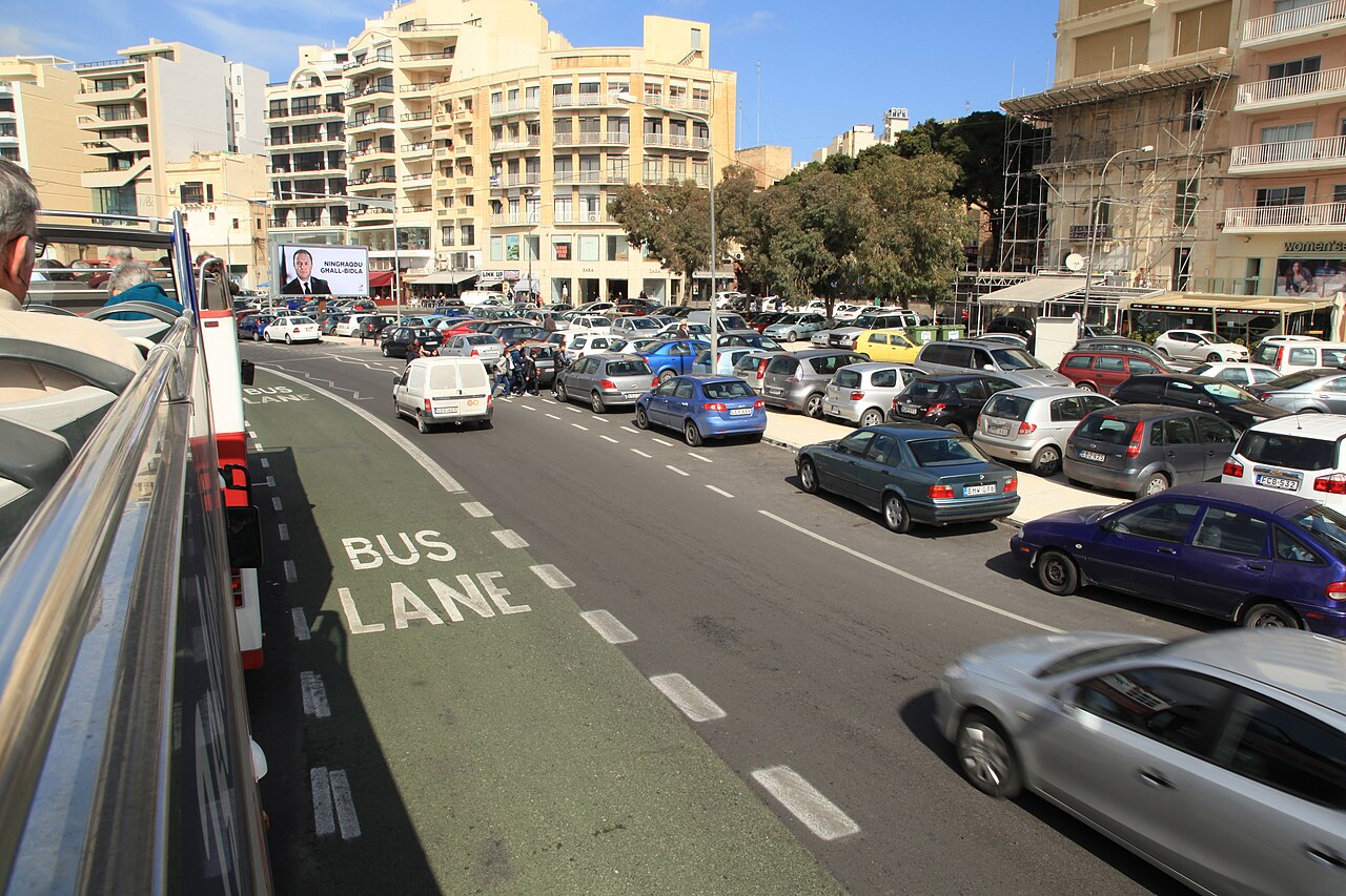 Traffic on the seafront road in Sliema beside a marked bus lane