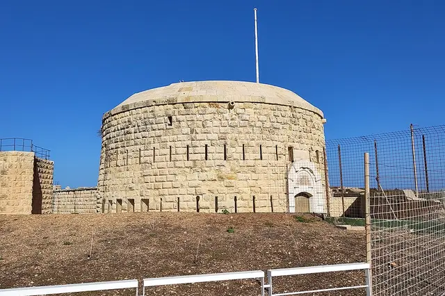 The round stone keep of Fort Tigné under a blue sky
