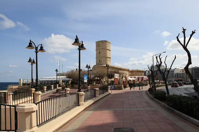 Paved promenade on Tower Road leading to Il-Fortizza, with ornate street lamps
